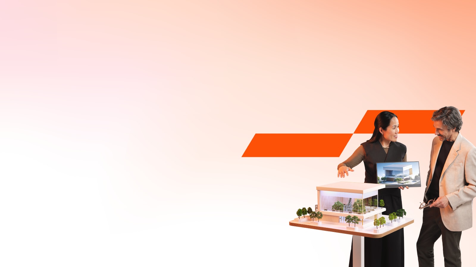 Two colleagues looking at sustanable architectural models and plans.