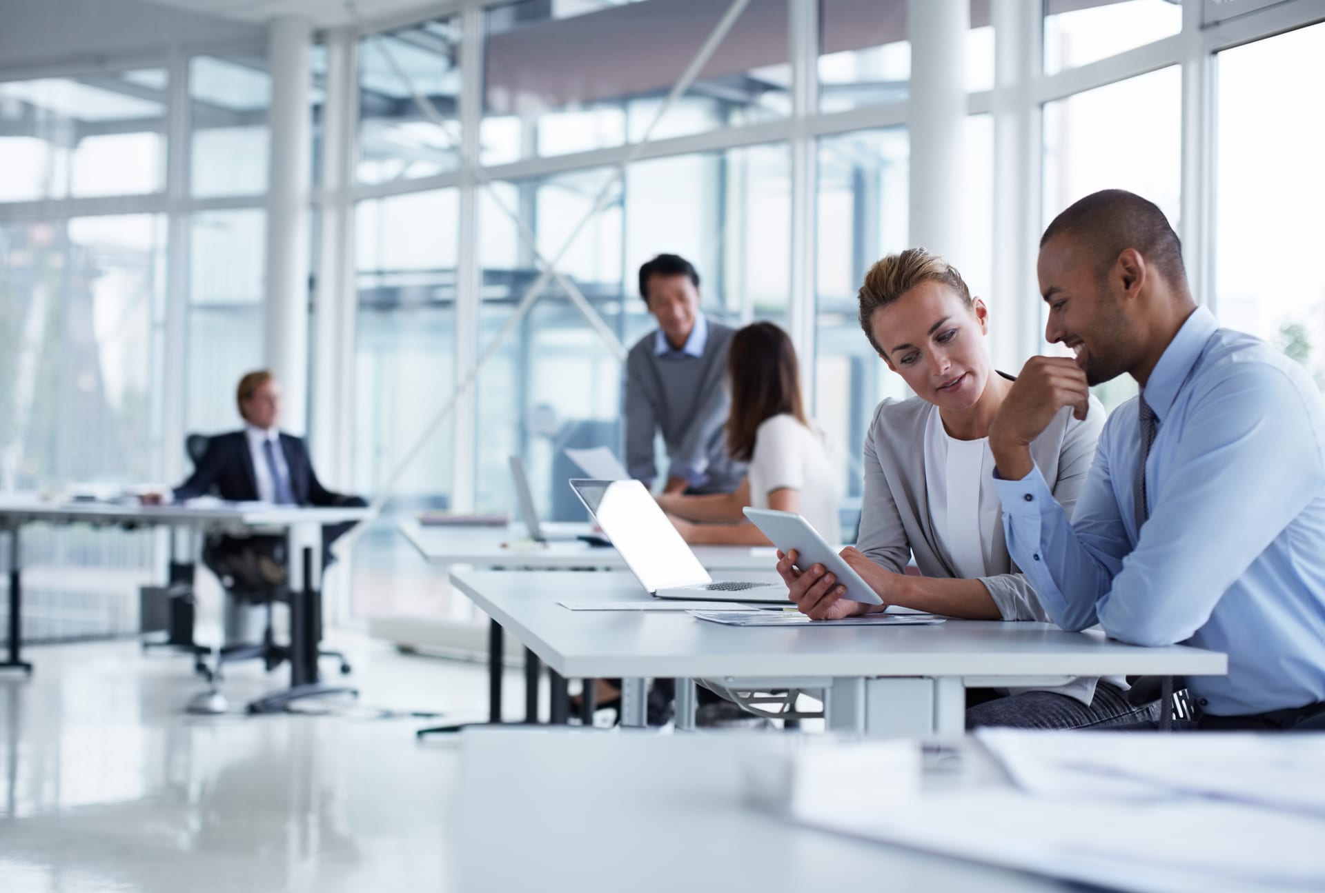 A group of people working with devices.